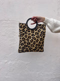 Bolso animal print asa redonda