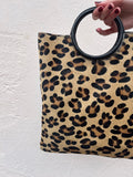 Bolso animal print asa redonda