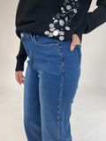 Jeans denim azul tachuelas